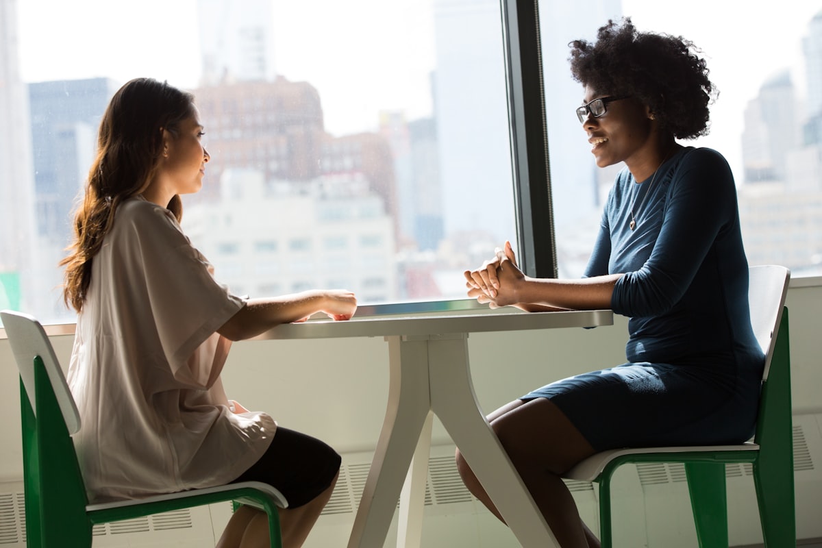 An adviser talking through cover with a business owner
